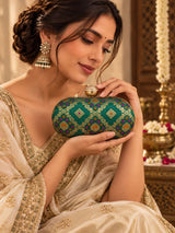 Light green oval clutch bag by THE TAN CLAN featuring a sleek design and compact size, perfect for evening or casual occasions.