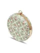 Green round clutch bag from The Tan Clan's Ariba collection with a smooth, stylish design and compact shape.