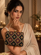 Mahi Black Casket Clutch by THE TAN CLAN featuring sleek design and textured surface for elegant evening wear.