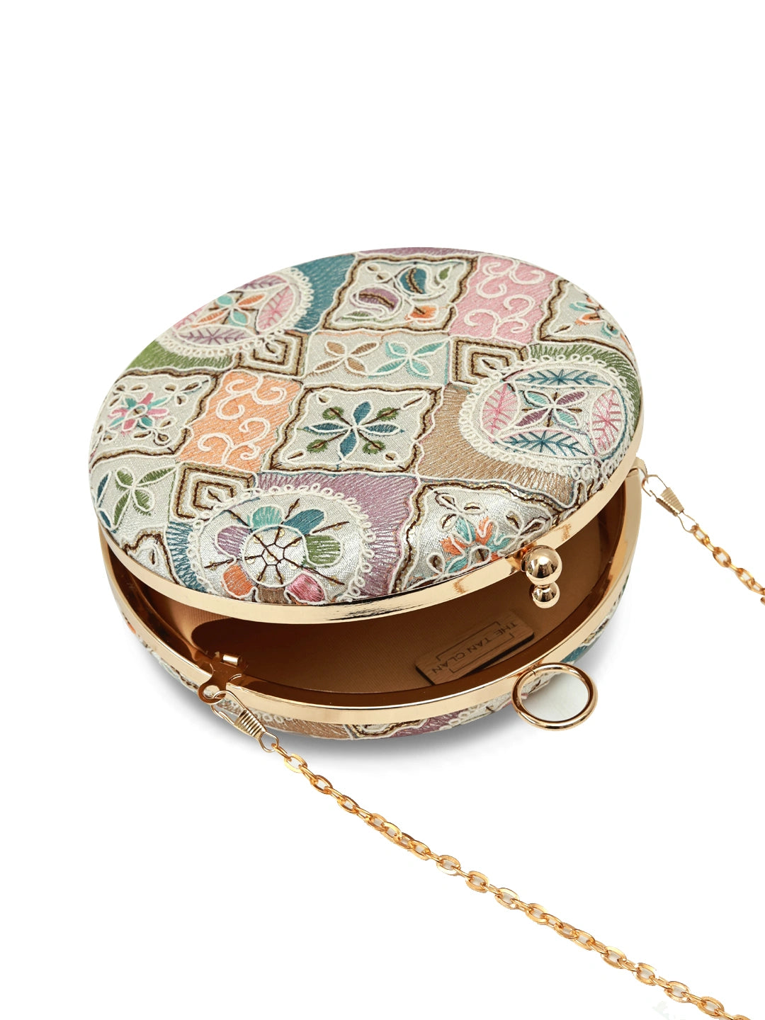 Mughal Round Clutch by The Tan Clan featuring intricate traditional patterns and a round shape in rich, vibrant colors.