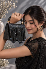 Maria Blue handcrafted beaded tasselled bag by THE TAN CLAN, featuring intricate beadwork and a stylish tassel detail.