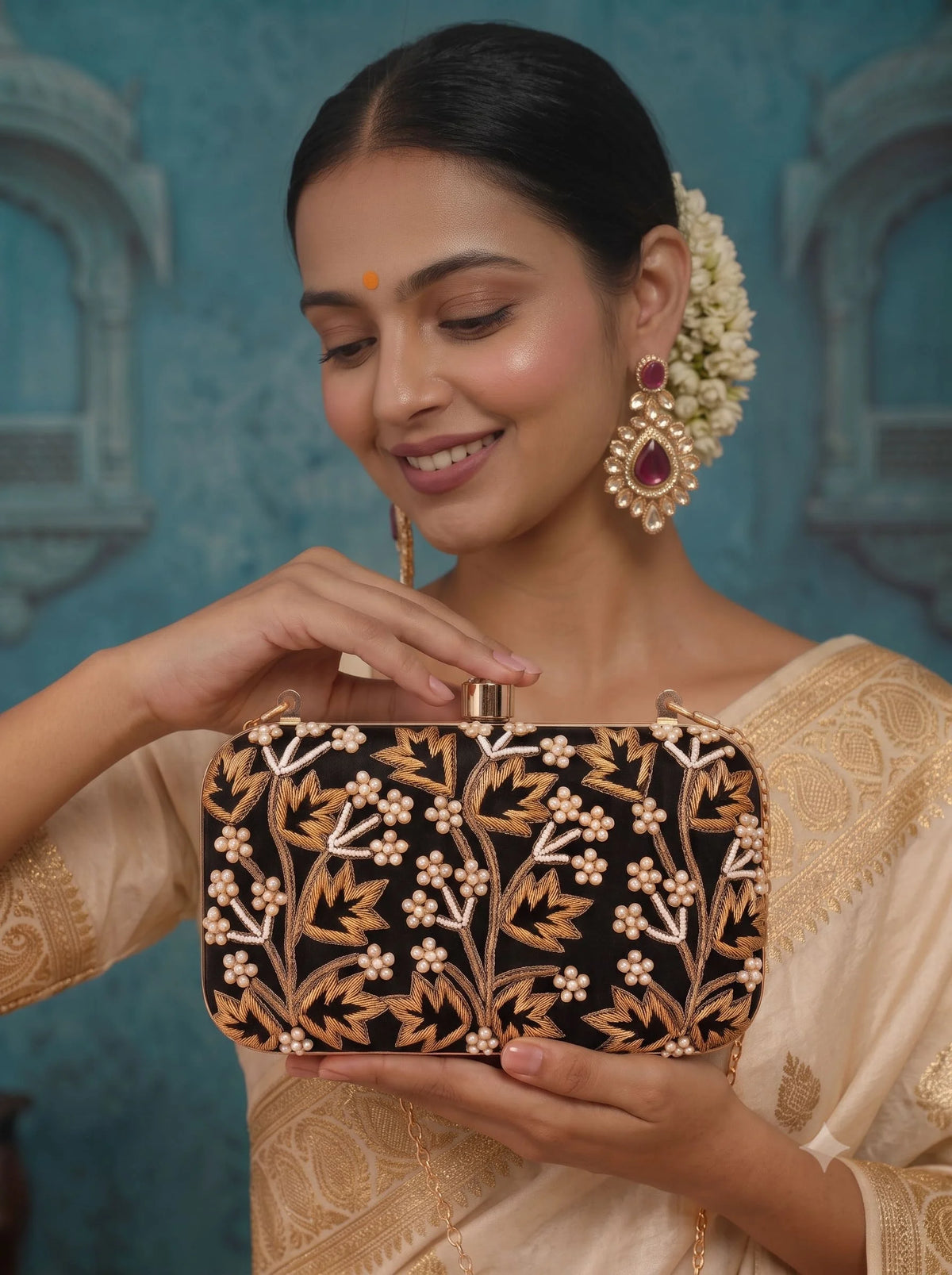 Black embroidered box clutch by THE TAN CLAN with intricate embroidery and a sleek, compact design for elegant occasions.