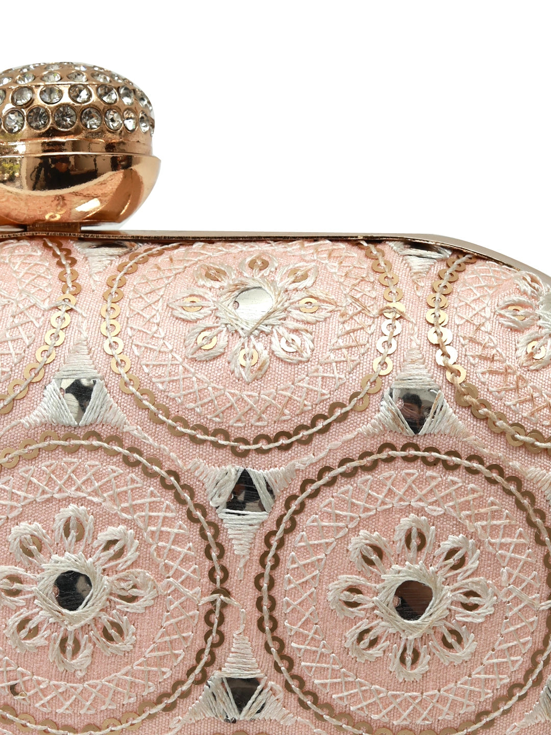 Inaara Peach oval clutch purse by The Tan Clan, featuring a sleek design and elegant oval shape with a smooth peach finish.
