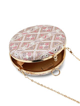 Pink round clutch bag from The Tan Clan's Ariba collection with a smooth, glossy finish and compact design.
