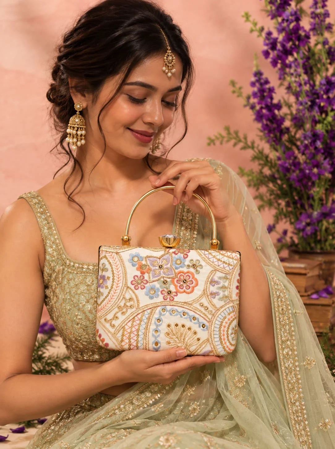 Resham embroidered clutch purse from THE TAN CLAN featuring intricate embroidery and a elegant casket shape.