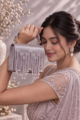 Maria Lilac handcrafted beaded tasselled bag by THE TAN CLAN featuring intricate beadwork and a stylish tassel design.