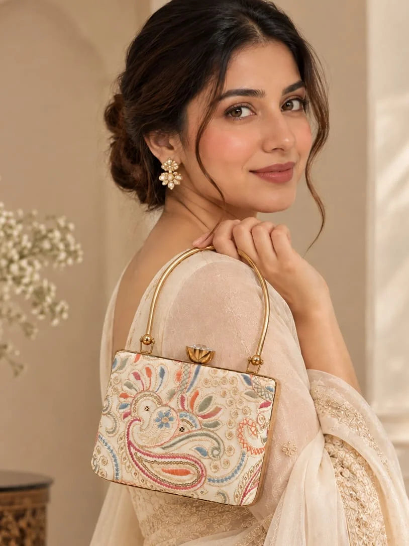 Kalki Casket embroidered clutch by THE TAN CLAN featuring intricate embroidery and a compact, stylish design for evening occasions.