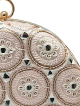 Peach round clutch purse by The Tan Clan with a smooth finish and compact design, perfect for evening accessories.