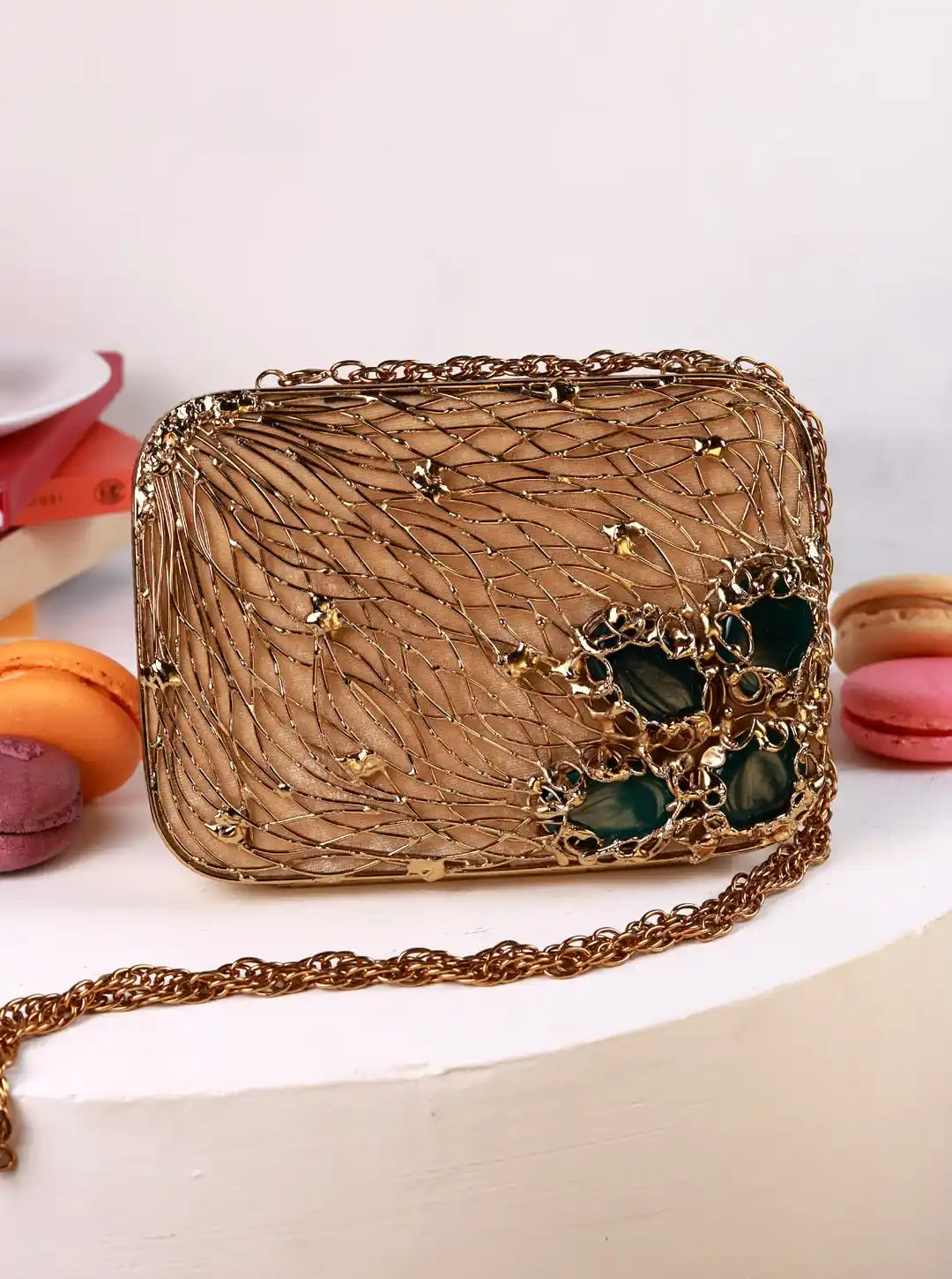 Decorative handbag with chain strap on a white background