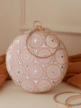 Inaara Peach round clutch by The Tan Clan with gold-tone clasp and smooth leather finish, perfect for elegant evening occasions.