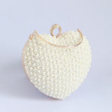 Ulfat white pearl embroidered heart clutch with hand embroidery, featuring intricate details and a stylish design by The Tan Clan.