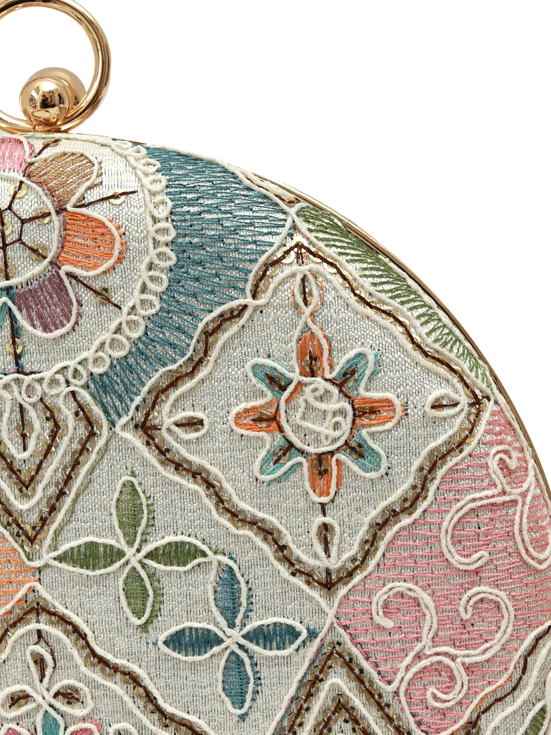 Mughal round clutch bag by The Tan Clan featuring intricate traditional patterns and a circular shape with a zipper closure.