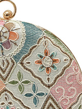 Mughal round clutch bag by The Tan Clan featuring intricate traditional patterns and a circular shape with a zipper closure.