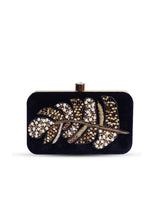 Afrah hand embroidered leaf clutch by The Tan Clan featuring intricate leaf designs and colorful embroidery on fabric.