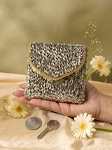 Anaya Gold Envelope Bag by THE TAN CLAN shown with sleek gold envelope design and elegant wrist strap for stylish occasions.