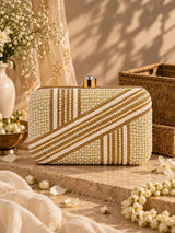 Zara Pearl Box Clutch by THE TAN CLAN featuring a sleek square shape with pearl embellishments and a metallic clasp closure.