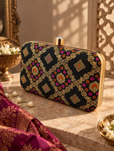 Mahi Black Box Clutch by THE TAN CLAN with sleek rectangular design and minimalist style, featuring a smooth matte finish.