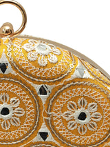Yellow round clutch bag from The Tan Clan's Inaara collection, featuring a sleek design and vibrant color for stylish occasions.