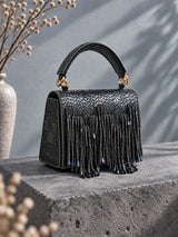 Maria Blue handcrafted beaded tasselled bag by THE TAN CLAN with intricate beadwork and tassel details, stylish and vibrant.
