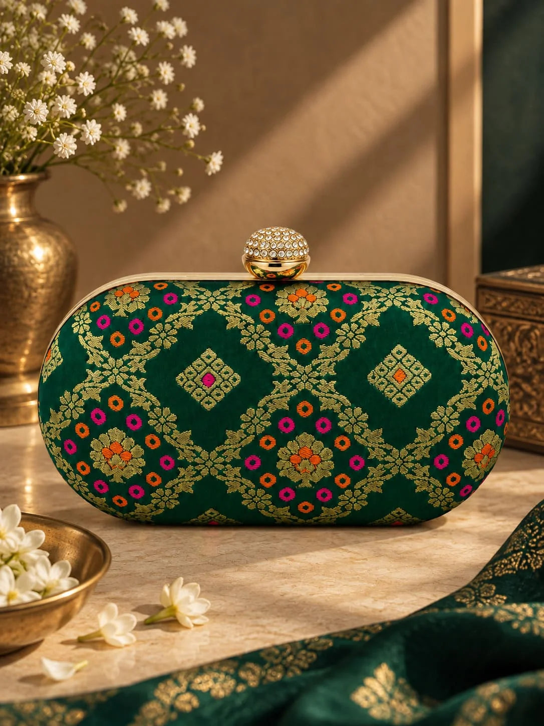 Dark green oval clutch bag from THE TAN CLAN with a sleek, stylish design and compact shape.
