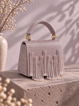 Maria Lilac handcrafted beaded tasselled bag by THE TAN CLAN, featuring intricate beadwork and a tassel detail in soft lilac color.