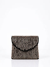 Anaya black envelope bag by THE TAN CLAN featuring a sleek, minimalist design with a flap closure and compact size.