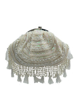 Tan Tan Clan Nora tasselled half moon batua bag with woven design and fringe detailing, ideal for stylish traditional accessories.
