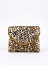 Anaya Gold Envelope Bag by THE TAN CLAN featuring a sleek gold metallic finish and minimalist envelope design.