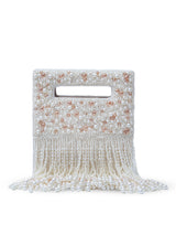 Ruby embellished flap-over clutch bag by The Tan Clan with vibrant red gemstones and sleek design.