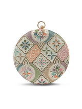 Mughal Round Clutch by The Tan Clan featuring intricate traditional embroidery and a round shape on a neutral background.