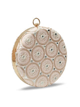 Inaara Peach Round Clutch by The Tan Clan, featuring a smooth peach-colored leather exterior with a sleek round shape.