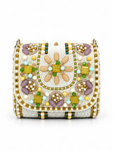 White hand-embroidered mini flap bag by THE TAN CLAN featuring intricate embroidery and a compact design.
