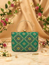 Light green Mahi casket clutch by THE TAN CLAN with elegant design and compact size, perfect for evening occasions.