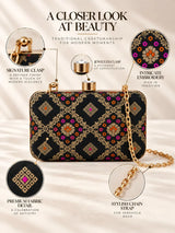 Mahi black box clutch by THE TAN CLAN featuring a sleek rectangular design with a smooth finish and compact size.