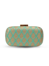Green long clutch bag by The Tan Clan with a sleek, minimalist design and smooth texture, perfect for elegant occasions.