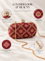 Red oval clutch bag from THE TAN CLAN featuring a sleek design and compact size, perfect for evening or special occasions.