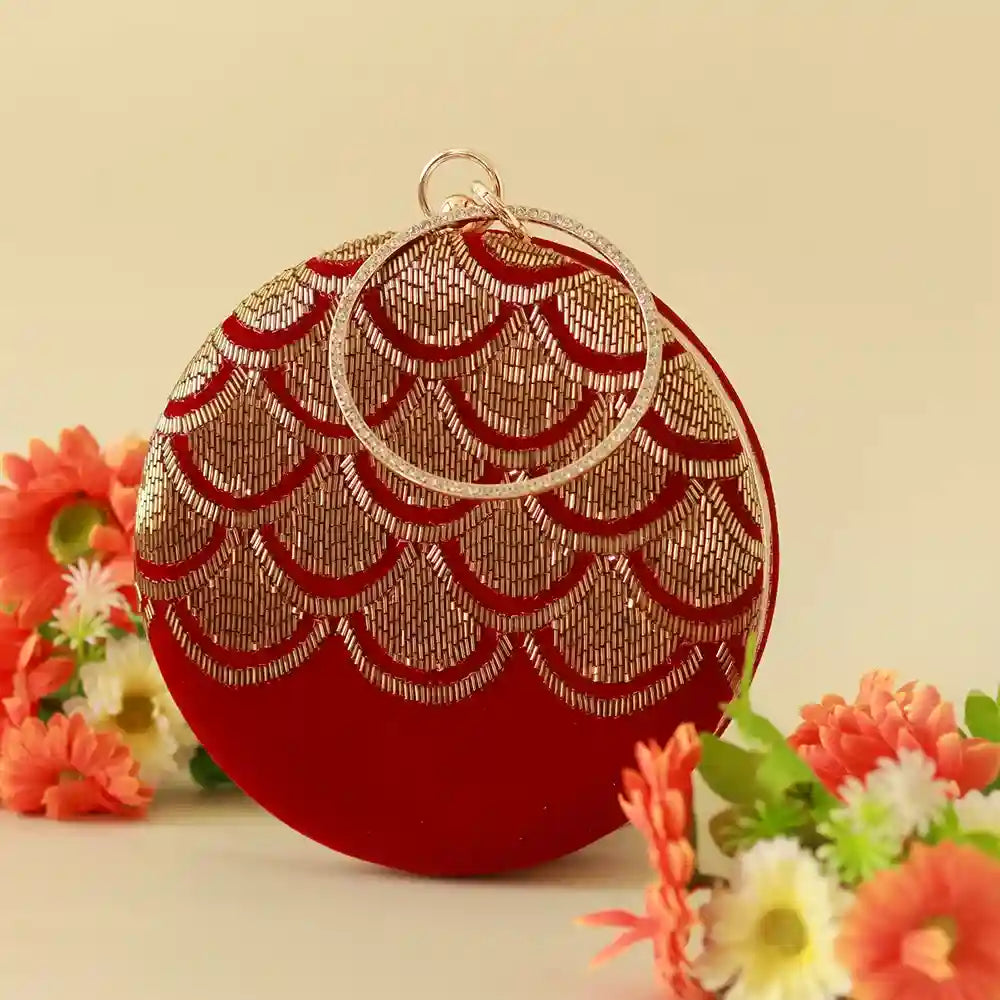 Hand embroidered Rajwada clutch by The Tan Clan featuring intricate designs and traditional craftsmanship.