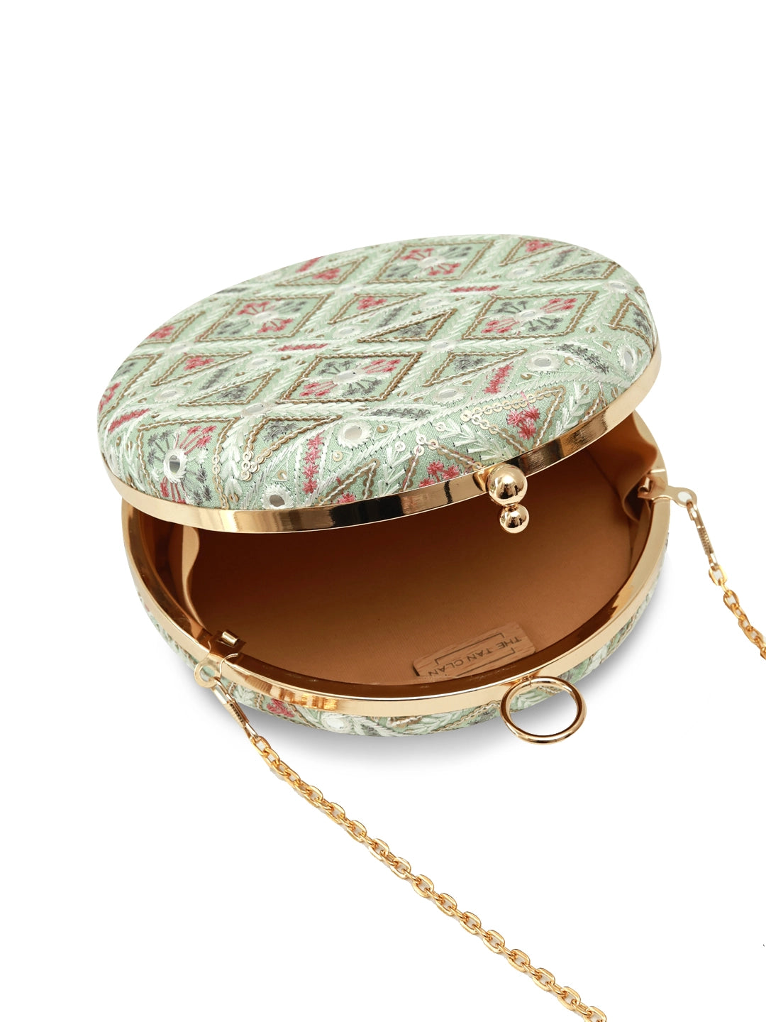 Green round clutch bag from The Tan Clan's Ariba collection, featuring a smooth texture and stylish design.