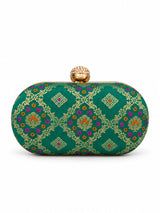 Light green oval clutch by THE TAN CLAN, featuring a textured surface and sleek design, perfect for stylish outings.