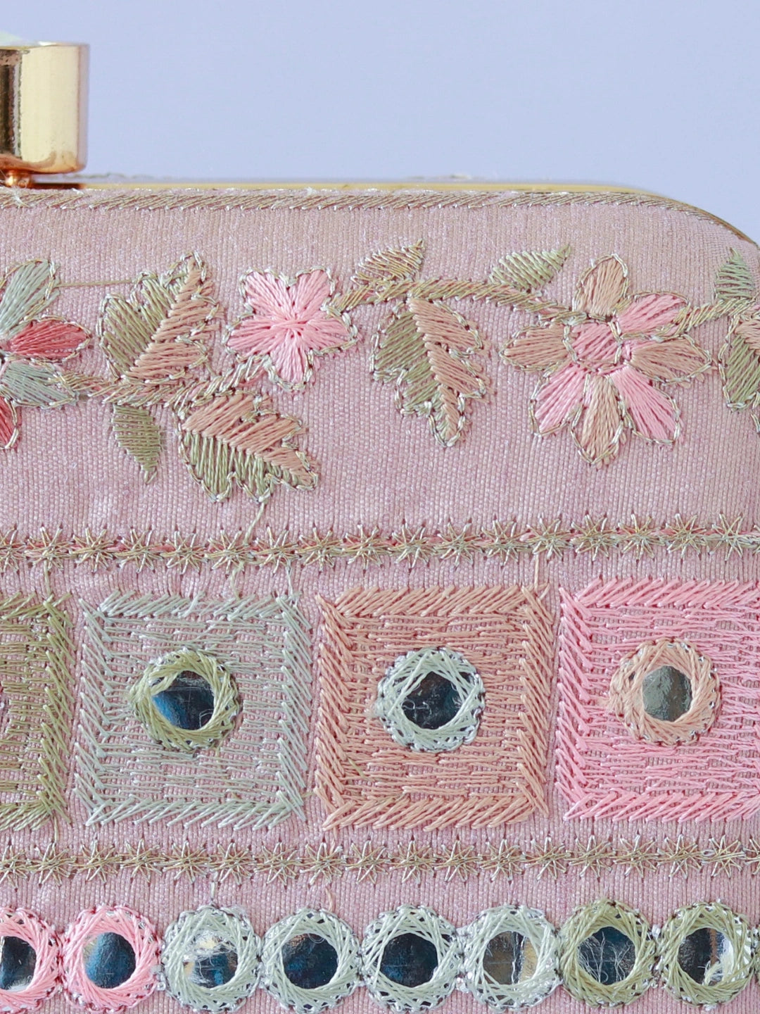 The Tan Clan Phulwaari floral box clutch with intricate embroidery and vibrant floral design for elegant occasions.