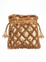 Golden sequined tasselled potli bag by THE TAN CLAN with intricate embellishments and traditional drawstring closure.