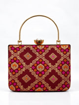 Mahi Red Casket Clutch by THE TAN CLAN with textured red finish and gold clasp, elegant and compact evening bag.