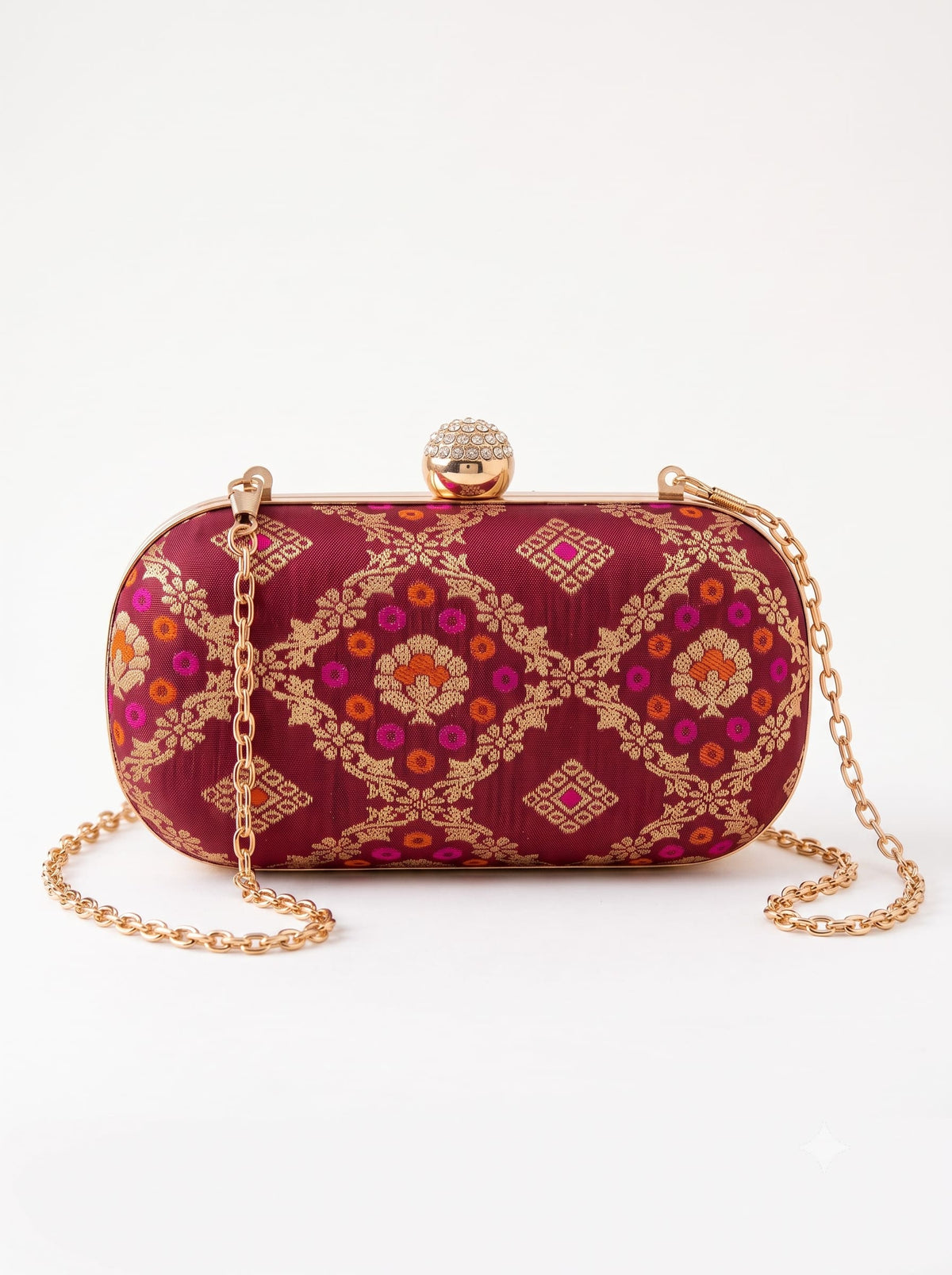 Red oval clutch purse by THE TAN CLAN featuring a smooth leather finish and compact design for stylish occasions.
