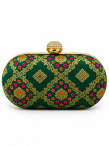 Dark green oval clutch bag from THE TAN CLAN featuring a sleek design and compact size, perfect for stylish occasions.