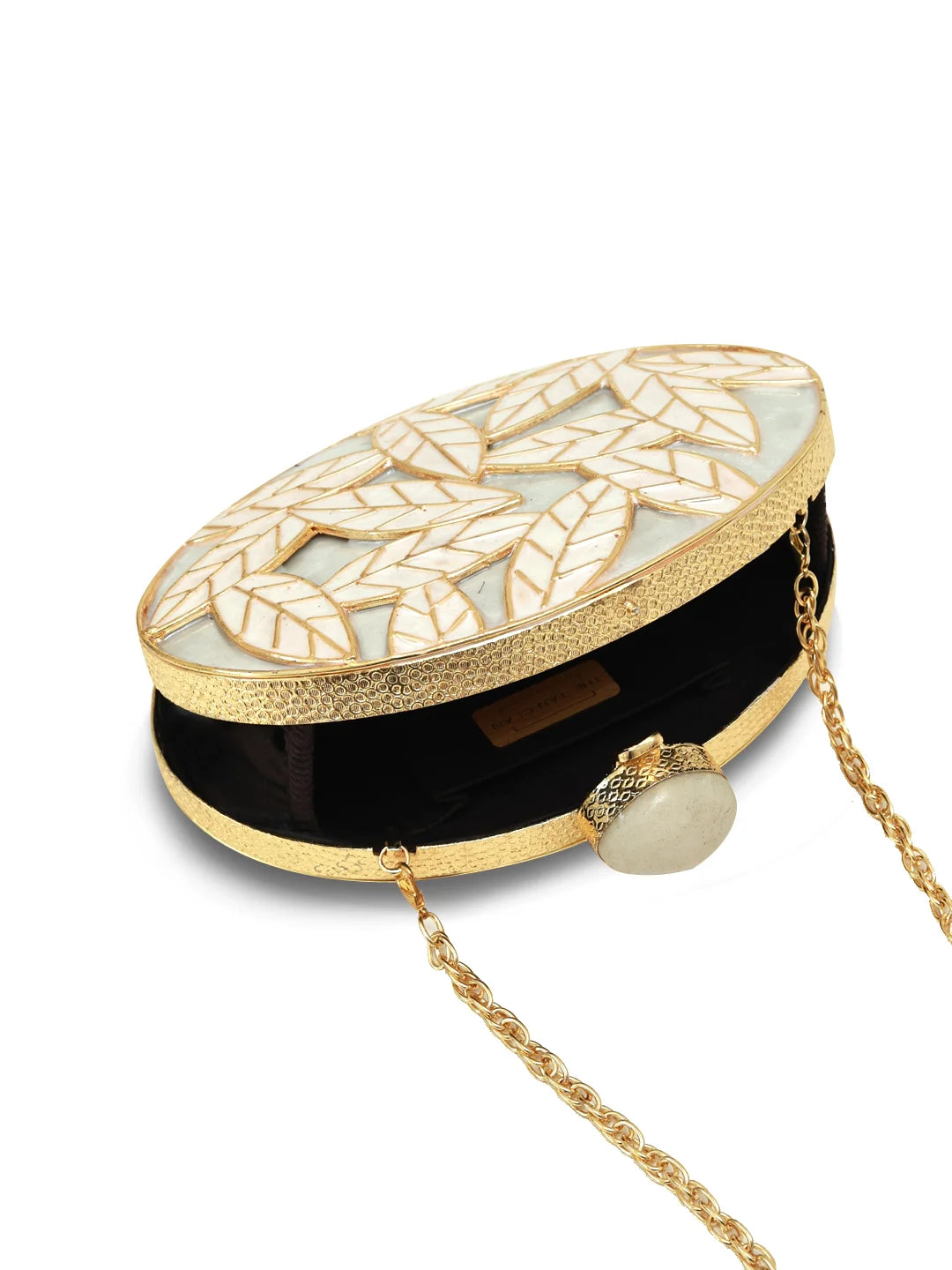 Elegant clutch bag with gold chain and leaf pattern on a white background