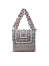 Nysa beige mini bag by The Tan Clan with embroidered handle, featuring a compact design and stylish details.