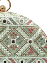 Green round clutch bag from The Tan Clan's Ariba collection, featuring a sleek design and vibrant color.