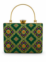 Dark green Mahi casket clutch by THE TAN CLAN with gold-tone clasp and sleek rectangular design.