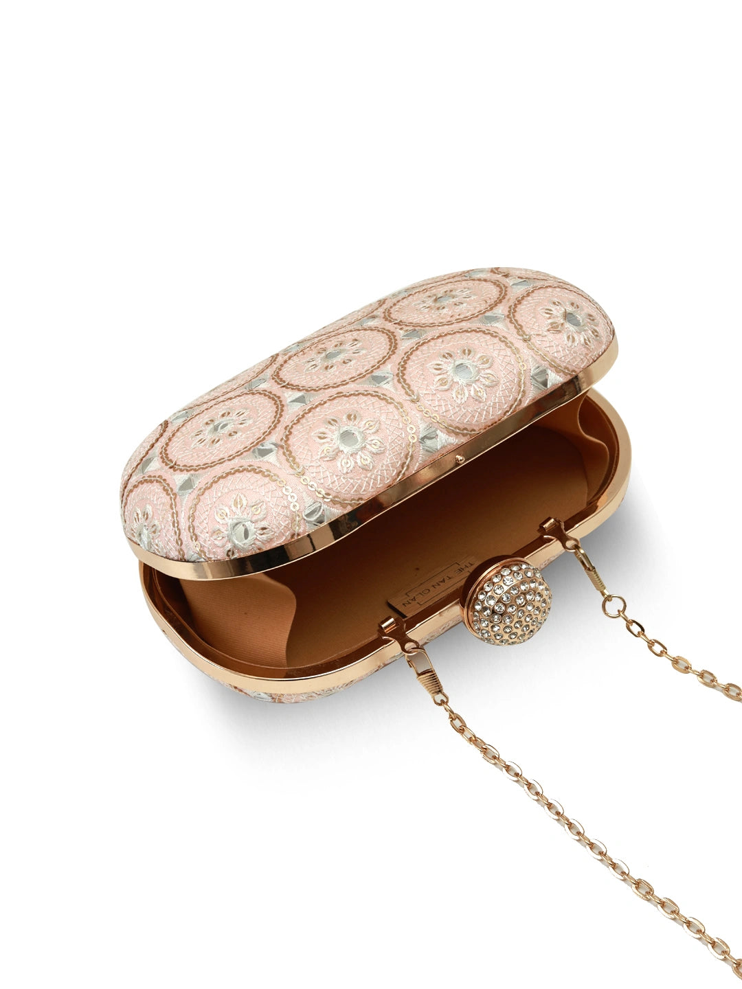 Inaara Peach Oval Clutch by The Tan Clan, featuring a smooth oval shape and elegant peach color, perfect for evening accessories.