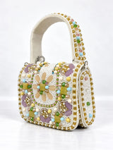 White hand-embroidered mini flap bag by THE TAN CLAN featuring intricate craftsmanship and elegant design.
